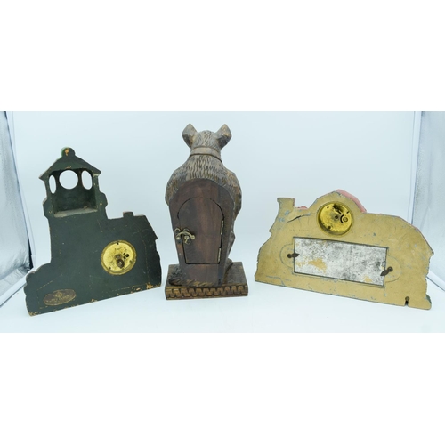 2830 - A wooden American art clock of a light house together with a cast iron clock and a bear clock.