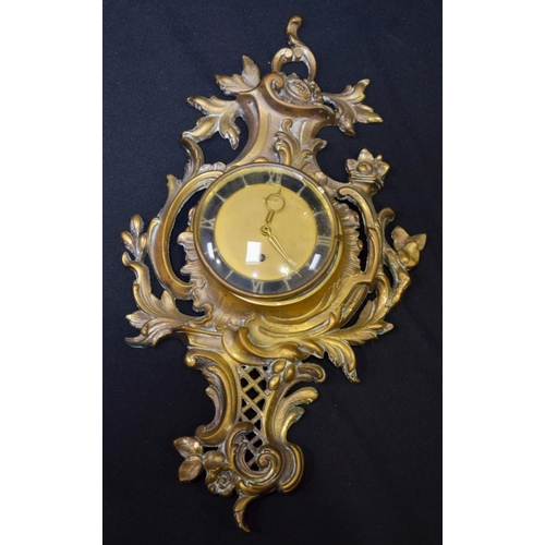 2831 - A large carved wooden surround clock and a  cartel clock 77cm (2).