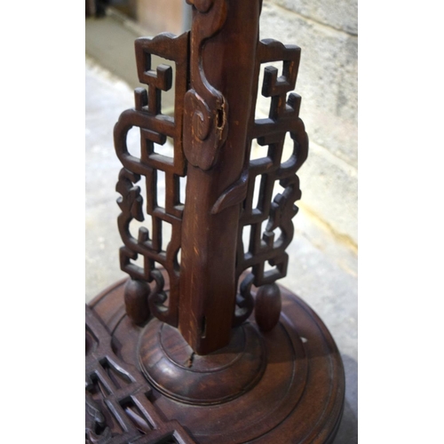 2869 - A hardwood oriental lamp stand in the shape of a dragon 164 cm.