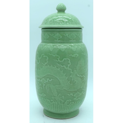 2877 - A Celadon ginger car and cover decorated with dragons and clouds in relief 31 cm (2).