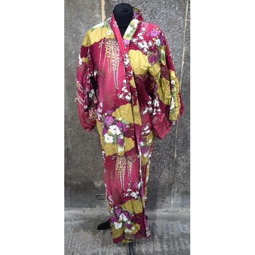 2881 - A quantity of oriental fabrics, a Tanka ,Silk jackets, Kimono, silk dolls etc Qty.