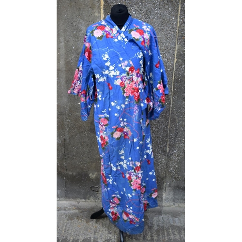 2881 - A quantity of oriental fabrics, a Tanka ,Silk jackets, Kimono, silk dolls etc Qty.