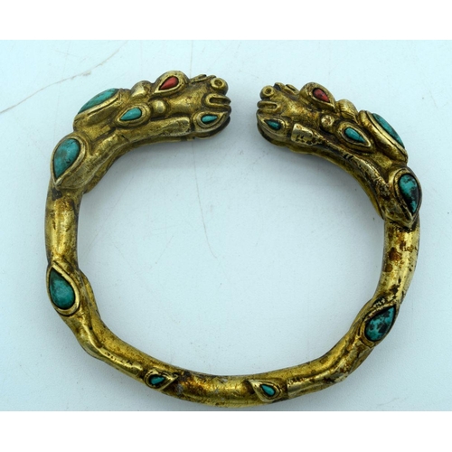 2896 - A yellow metal dragon bracelet with Turquoise stone 8 x 7 cm.