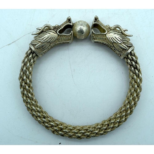 2900 - Chinese white metal dragon bracelet and 5 Chinese rings 9 x 9cm (6).