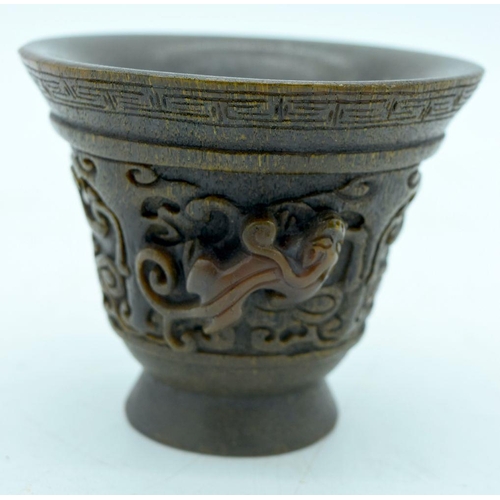 2907 - A Chinese horn carved Libation cup  9.5 x 8cm.