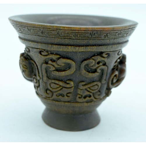 2907 - A Chinese horn carved Libation cup  9.5 x 8cm.