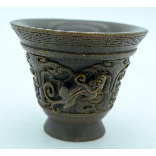 2907 - A Chinese horn carved Libation cup  9.5 x 8cm.