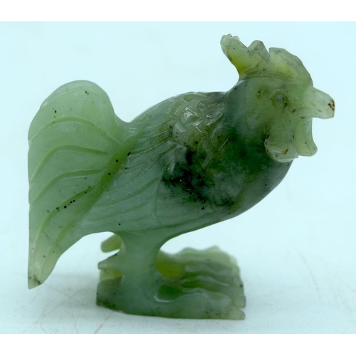 2922 - A collection of Jade and hard stone including a Cockerel , pendants etc (8) 6cm .