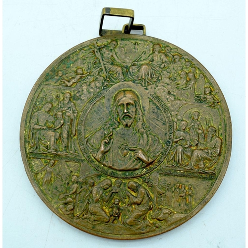 2928 - A large religious bronze plaque together with a another and a Peruvian yellow metal broach 10cm (3)