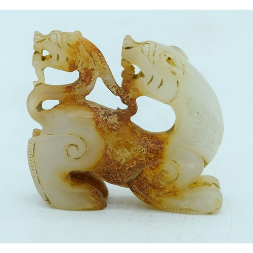 2930 - A carved Mutton jade figure of a lion 6 x 5cm .