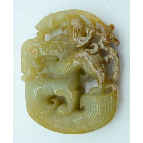 2931 - A carved Jade pendant 5.5.x 4 cm.