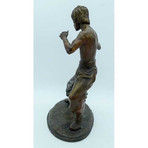 2953 - A bronze statue of Bruce Lee 35cm.