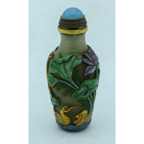 2964 - Chinese Peking Glass snuff bottle decorated in relief with lotus and frogs  8 cm.