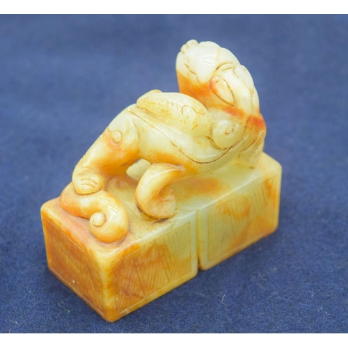 2965 - A Chinese jade seal carved with a dragon 6.5 x 6cm .