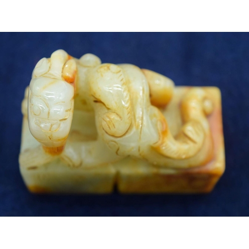 2965 - A Chinese jade seal carved with a dragon 6.5 x 6cm .