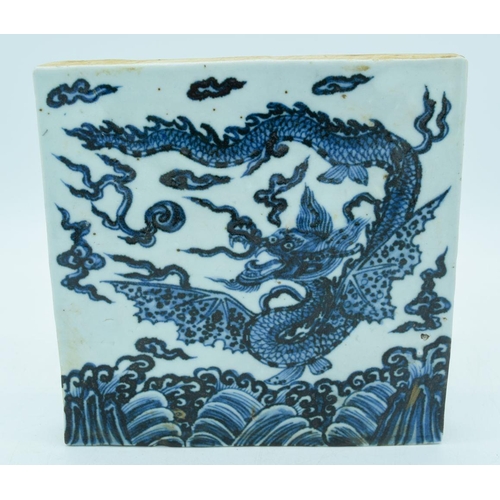 2982 - A Chinese blue and white temple tile decorated with a dragon 20 x 20cm.