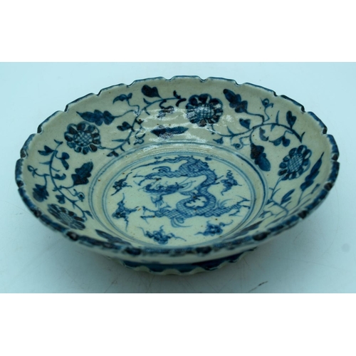 2984 - A Chinese Blue and white dragon bowl , a Bi disc  cm  and a blanc de chine figure of a woman.