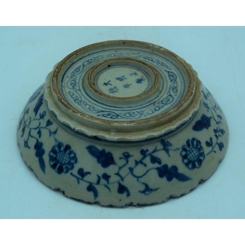 2984 - A Chinese Blue and white dragon bowl , a Bi disc  cm  and a blanc de chine figure of a woman.