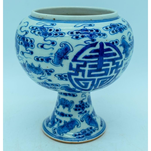 2989 - A Chinese blue and white stem cup decorated with bats 15cm.