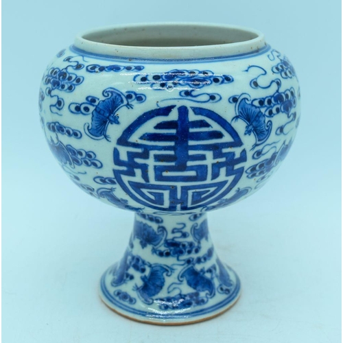 2989 - A Chinese blue and white stem cup decorated with bats 15cm.