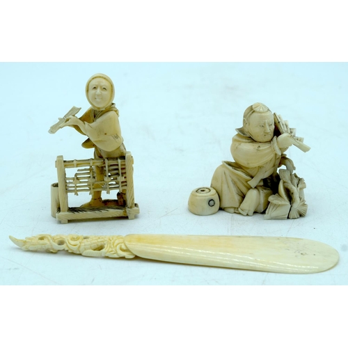 2919 - Two Japanese Ivory Okimono , a seated male holding a fan, a standing woman and a carved shoe horn 17... 