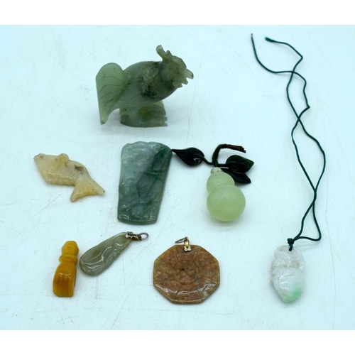 2922 - A collection of Jade and hard stone including a Cockerel , pendants etc (8) 6cm .