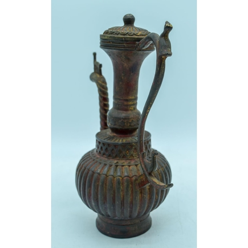 3003 - An Islamic  metal water jug 23 cm.