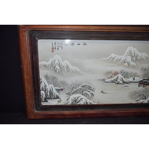 3006 - A Framed Chinese porcelain panel decorated with a snowy landscape 102 x 48 cm.