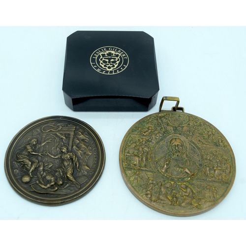 2928 - A large religious bronze plaque together with a another and a Peruvian yellow metal broach 10cm (3)