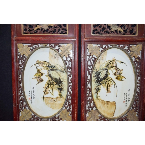 3007 - A Framed pair of Chinese porcelain panels decorated with birds and foliage 80 x 37cm. (2)