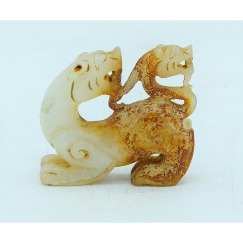 2930 - A carved Mutton jade figure of a lion 6 x 5cm .