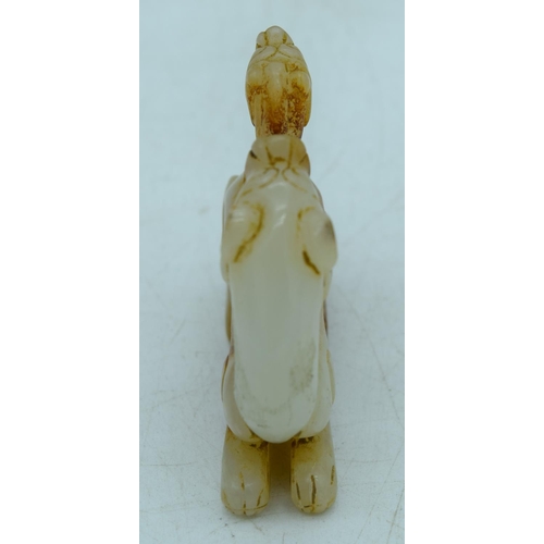 2930 - A carved Mutton jade figure of a lion 6 x 5cm .