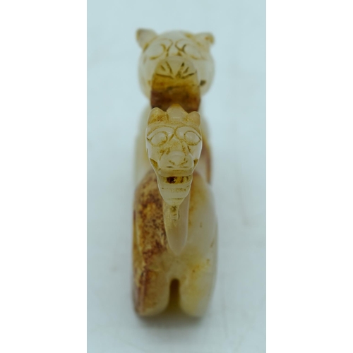 2930 - A carved Mutton jade figure of a lion 6 x 5cm .