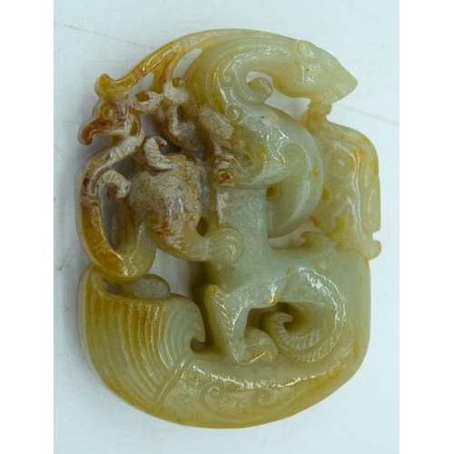 2931 - A carved Jade pendant 5.5.x 4 cm.