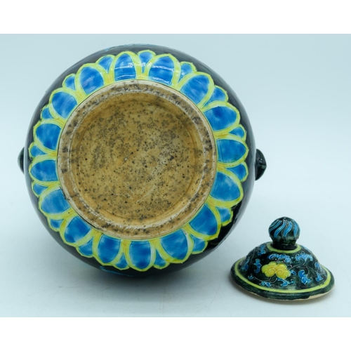 2941 - A Chinese wine pot  decorated with yellow and blue flowers in relief 30cm.