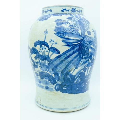 2946 - A large early 20th century blue and vase decorated with a phoenix and foliage 38cm.