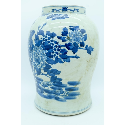 2946 - A large early 20th century blue and vase decorated with a phoenix and foliage 38cm.