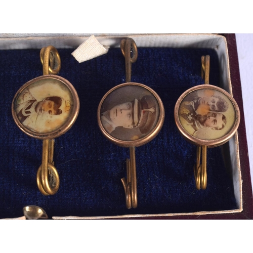 772 - SIX CASED ANTIQUE ENAMELLED PIN BADGES including the Franco British Exhibition 1908. (6)