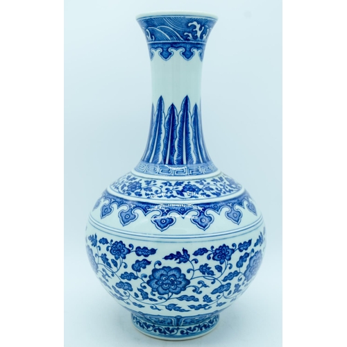 2947 - A Chinese blue and white vase decorated with lotus flower. 39cm.