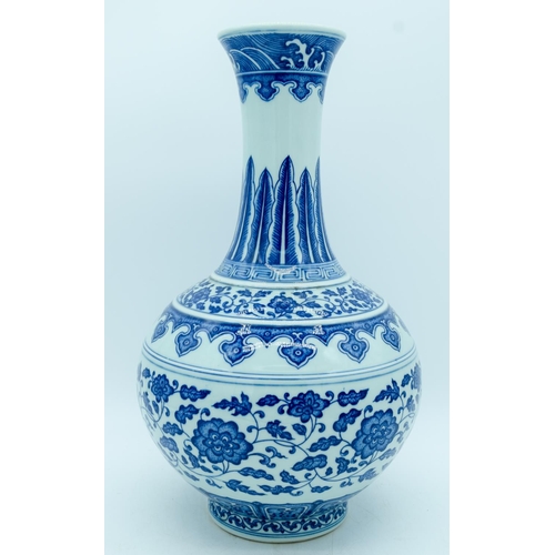 2947 - A Chinese blue and white vase decorated with lotus flower. 39cm.