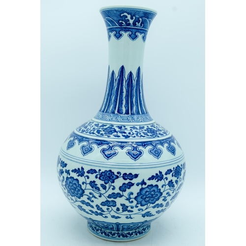 2947 - A Chinese blue and white vase decorated with lotus flower. 39cm.