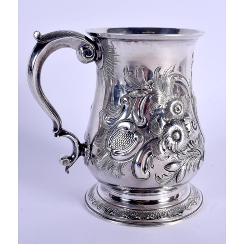 784 - AN ANTIQUE SILVER MUG decorated with foliage. London 1828. 339 grams. 13 cm high.