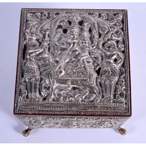 795 - A 19TH CENTURY INDIAN SILVER OVERLAID CASKET decorated with Buddhistic figures. 12 cm x 9 cm.