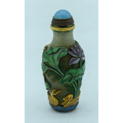 2964 - Chinese Peking Glass snuff bottle decorated in relief with lotus and frogs  8 cm.