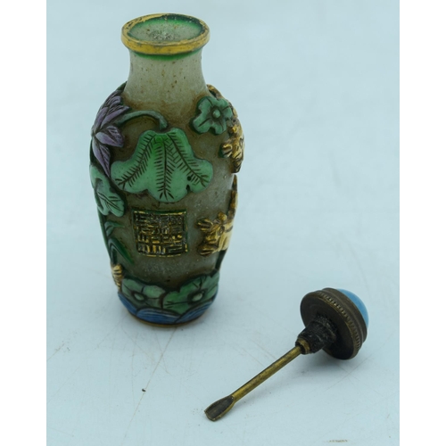 2964 - Chinese Peking Glass snuff bottle decorated in relief with lotus and frogs  8 cm.