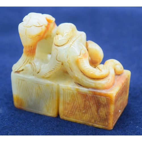 2965 - A Chinese jade seal carved with a dragon 6.5 x 6cm .