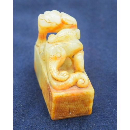 2965 - A Chinese jade seal carved with a dragon 6.5 x 6cm .