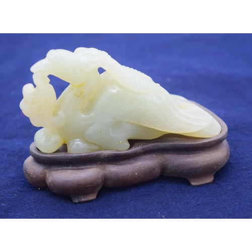 2966 - A Chinese carved  Jade boulder in the form of a duck on a stand. 10cm .