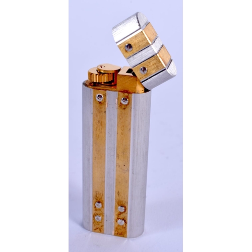 868 - A FRENCH CARTIER TWO TONE LIGHTER. 7 cm x 2.5 cm.