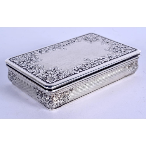 877 - A 1940 SILVER SNUFF BOX decorated with repousse foliage. 139 grams. 8.5 cm x 5.5 cm.